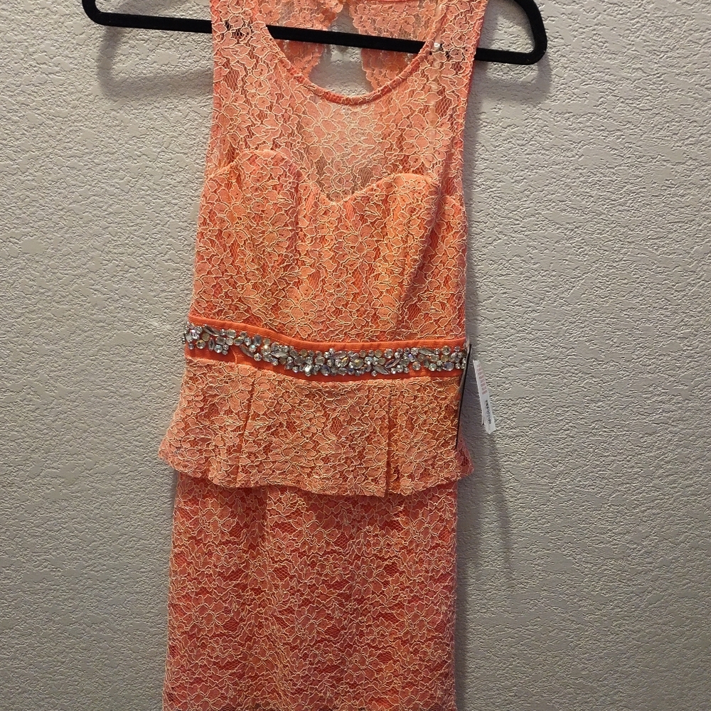 Lacy dress with built in lining cut out back
